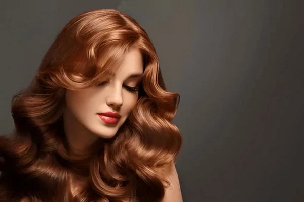 Butterfly layers on naturally wavy hair adding volume and movement