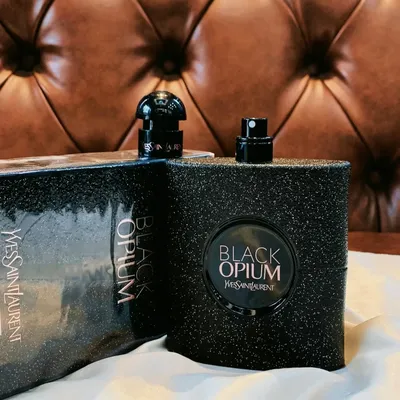 Yves Saint Laurent Black Opium perfume bottle with dark, glittery finish