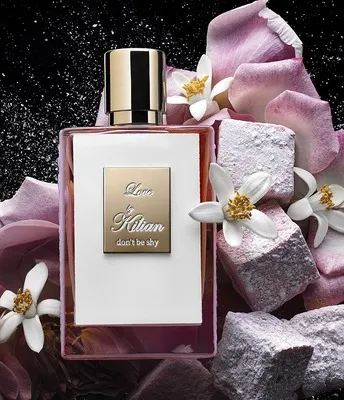 Kilian Love Don’t Be Shy perfume bottle with opulent white and gold accents