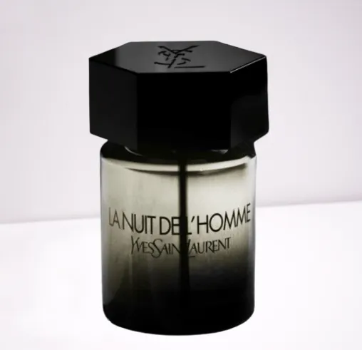 YSL La Nuit de L’Homme cologne with moody lighting and spices in the background, highlighting its seductive vibe.