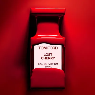 Tom Ford Lost Cherry perfume bottle with rich cherry-red hue